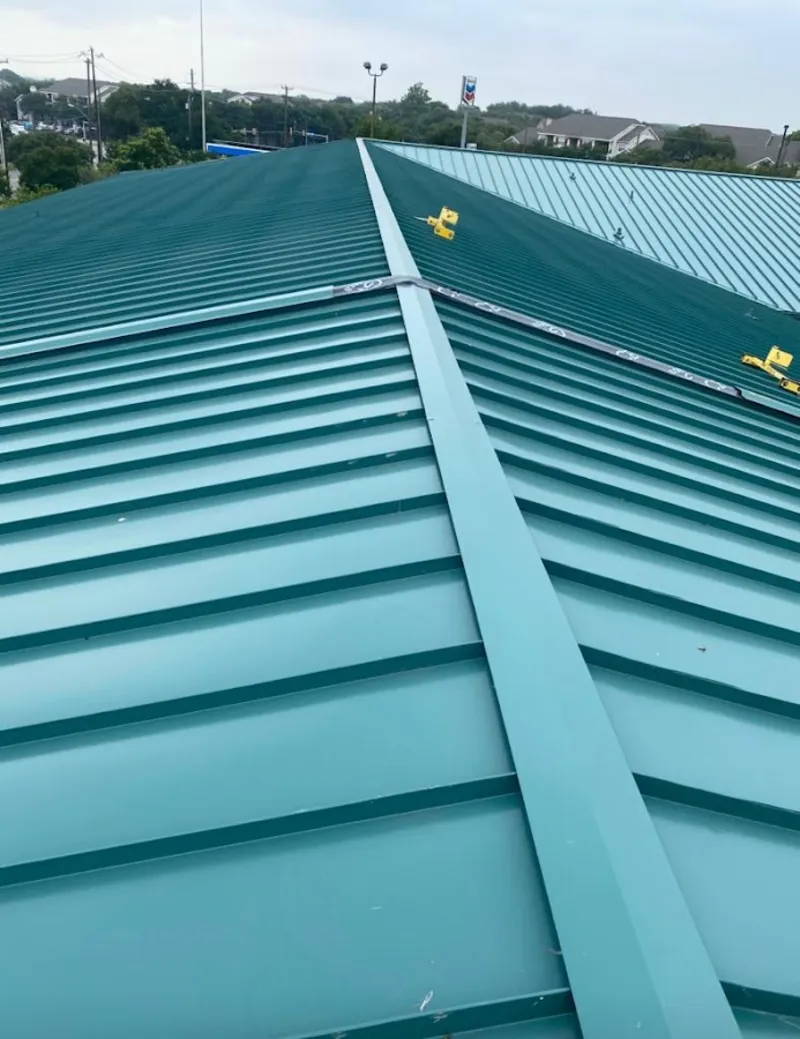 Green commercial metal roof ridge and valley for Metal Roof Repair in Oak Point